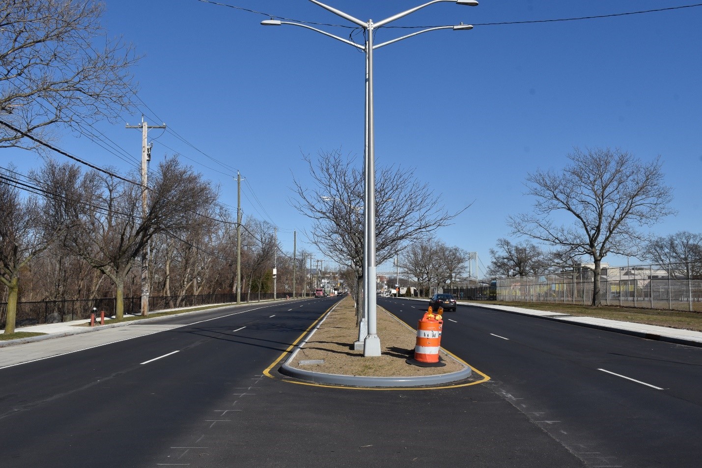 a finished curb and resurfaced roadway