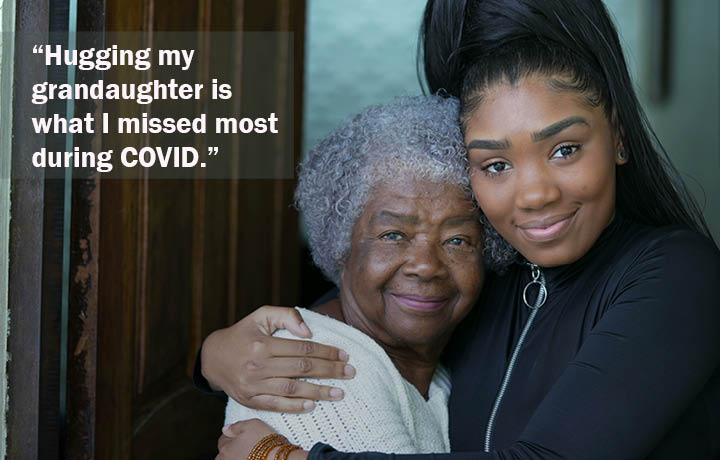 Grandmother hugging granddaughter
                                           