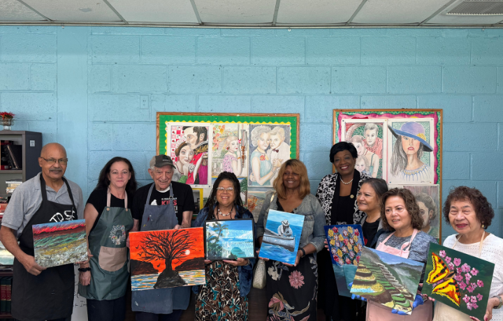 Commissioner and older adults at older adult center.