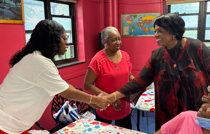 Commissioner and older adults at older adult center.