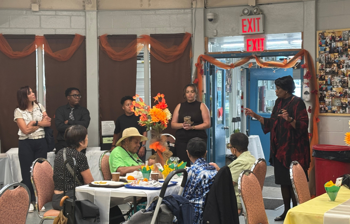 Commissioner and older adults at older adult center.