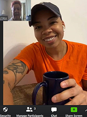 Two females, one younger and one older, chat over the a video call 