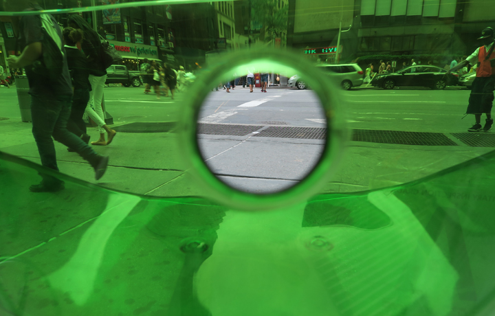 Looking at a NYC street through a green bottle