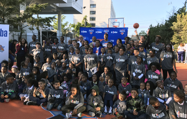 Administrator Carter and more than 100 children ages 7-14 at the sport court launch