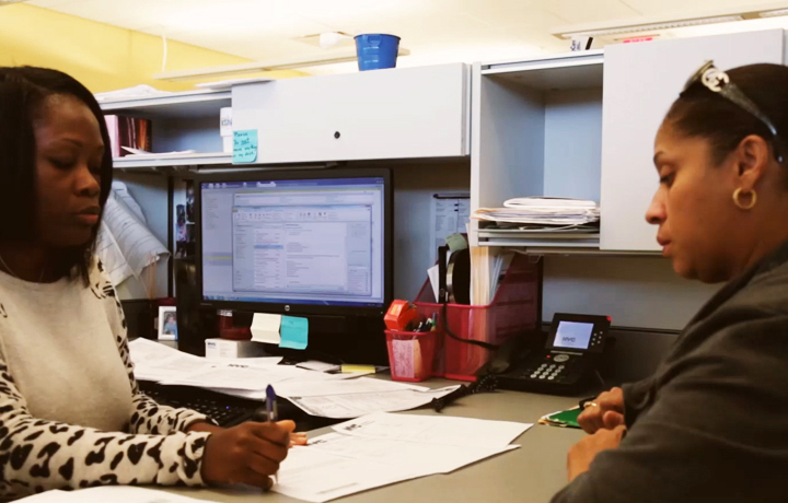 DHS employee attending to a client