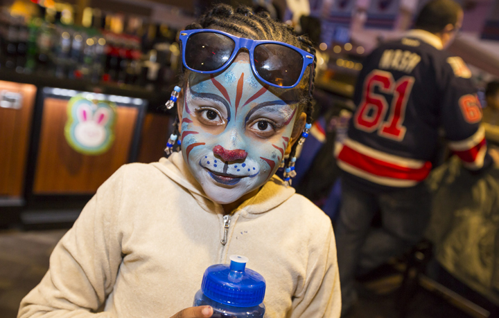 Kid with colorful tiger face paint