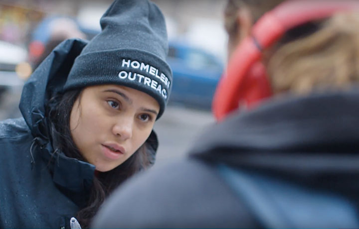 A team from DHS' NYC Homeless Outreach program talking to a man on the street