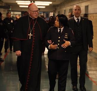 timothy is walking with the jail warden down the hallway