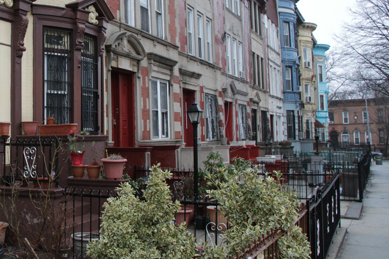 outside a row of houses in the daytime