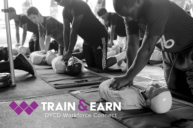 group of men practicing during a CPR training class