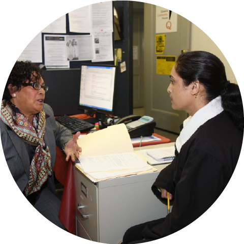two women have conversation in an office