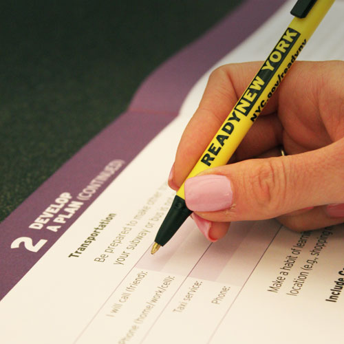 person filling out an emergency plan