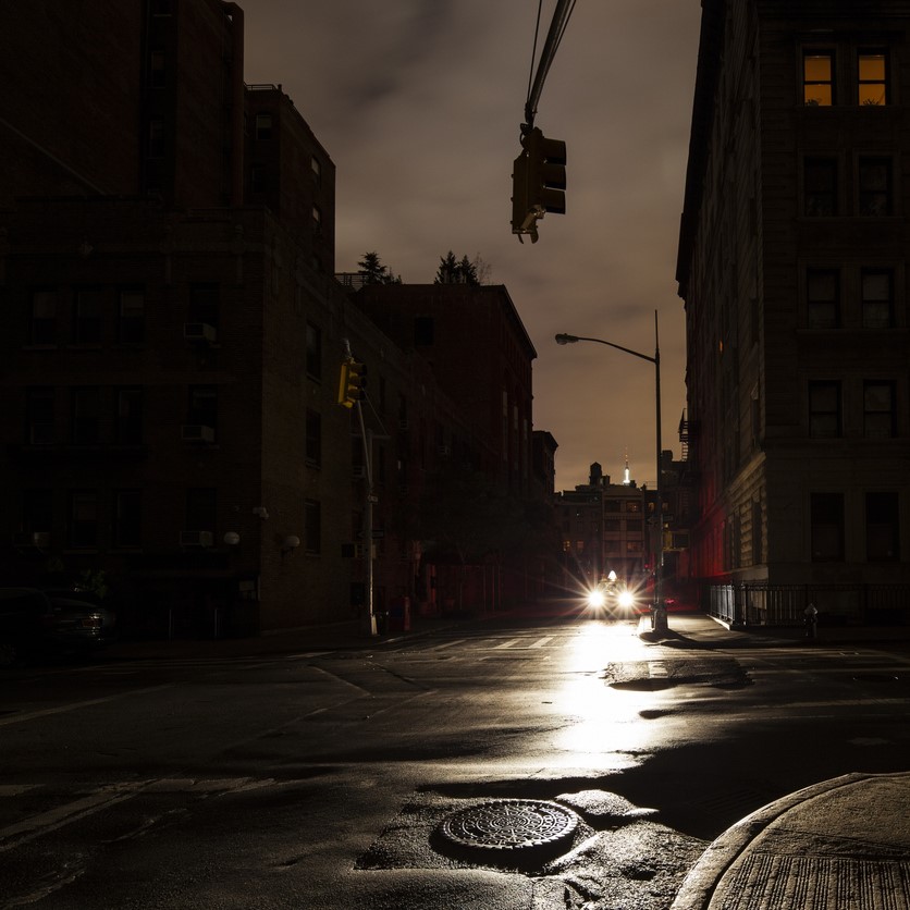 A dark city street during a power outage.