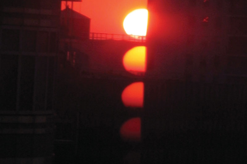 A photo of the sun at sunset.