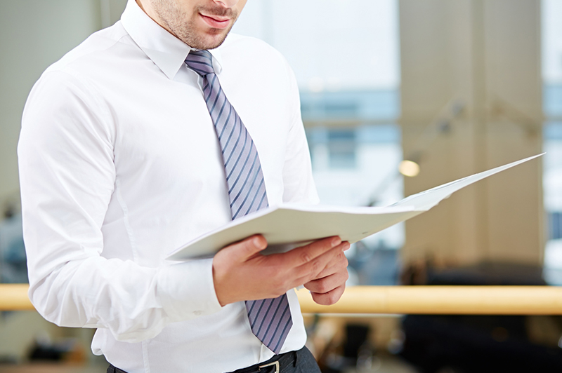 A person reading a report.