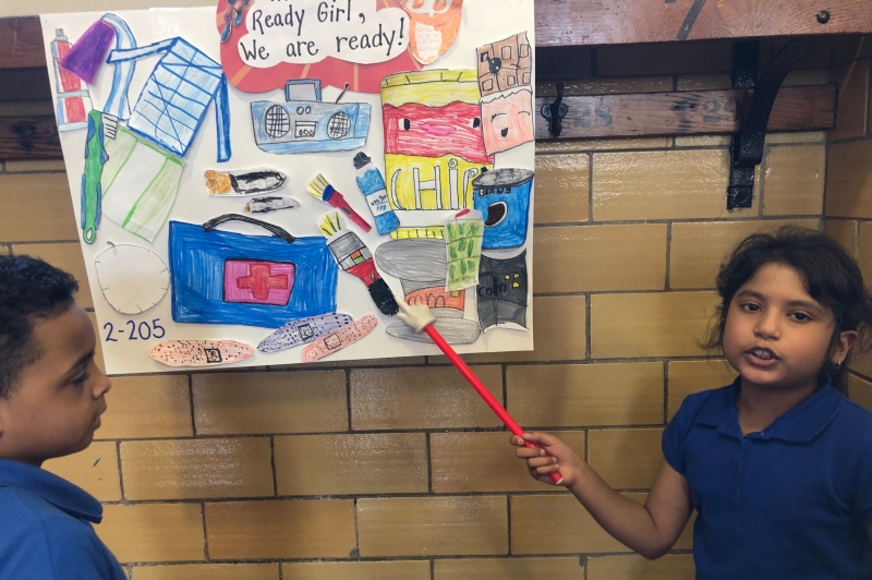 A student at the Ready School of the Year shows a poster about how to be ready