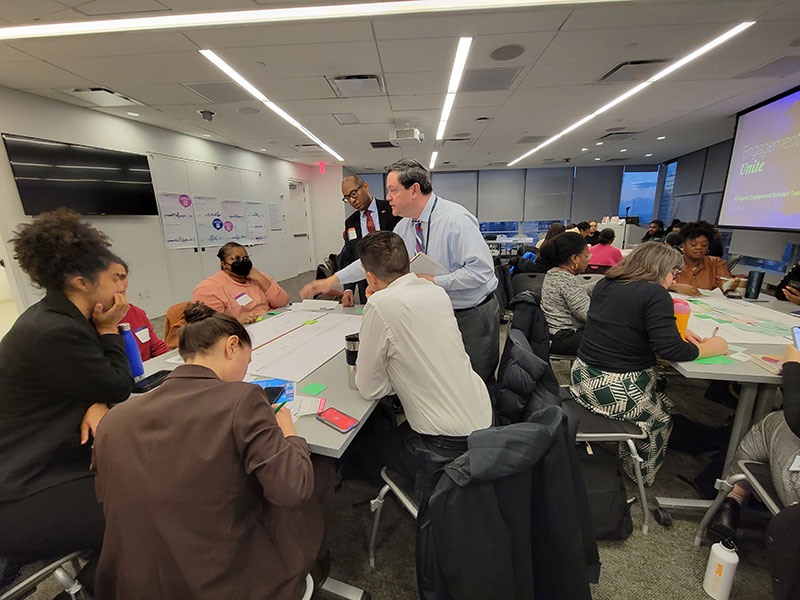 Group facilitators engaging with meeting participants.