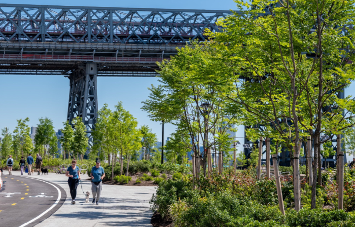 Park users walk in East River Park.
                                           