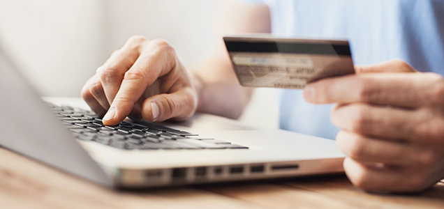 Image of a person paying with a credit card online