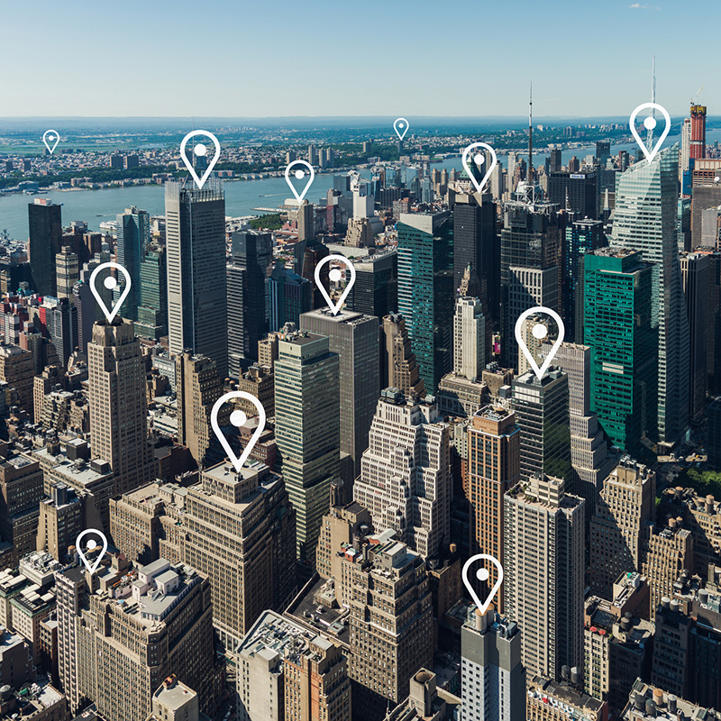 Photo of NYC map with location markers placed on random properties