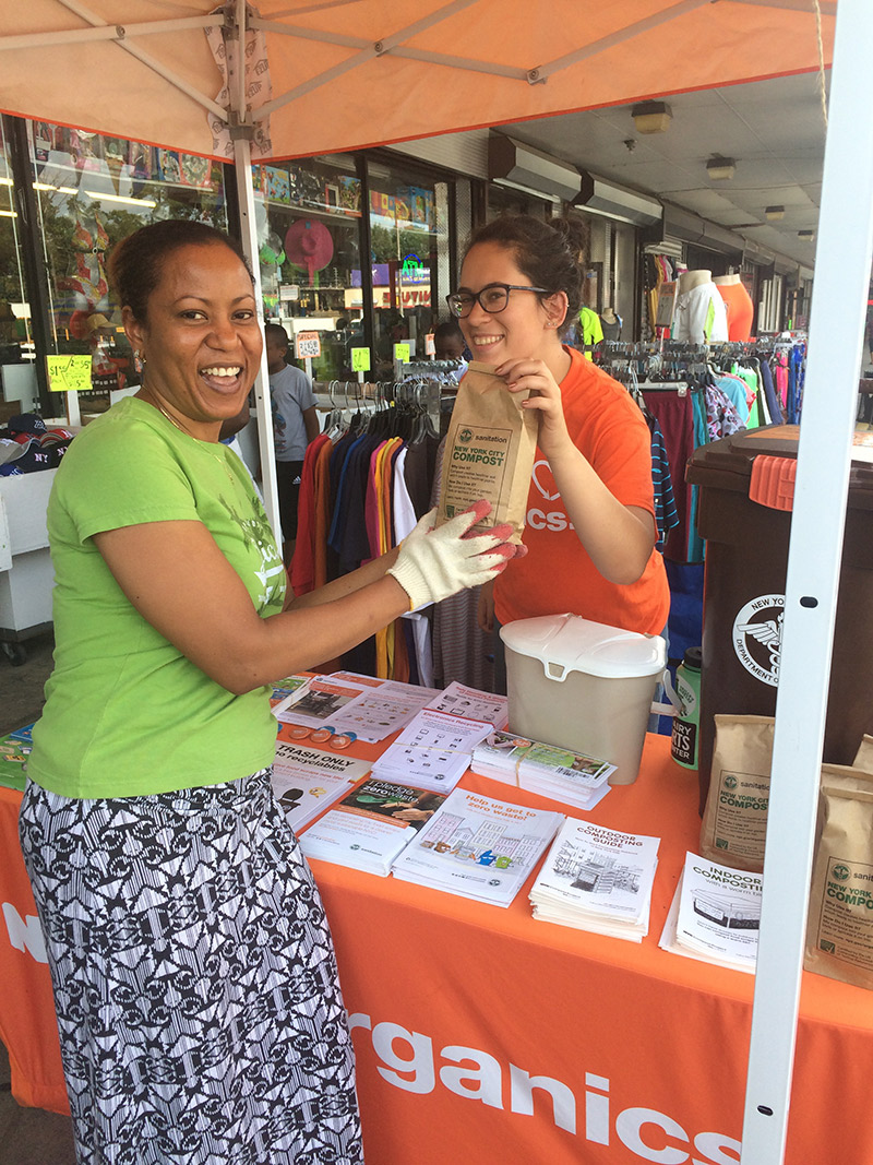 Two women and a bag of NYC Compost