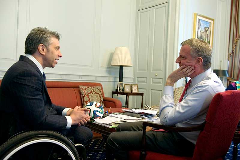 Photo of Mayor de Blasio and Commissioner Calise in City Hall and speaking with one another