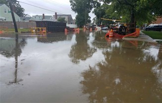 Prior to  construction, stormwater would collect on Hook Creek Boulevard between 256th  Street and 257th Street for days