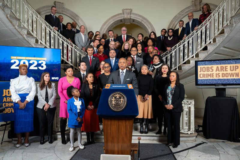 Mayor Adams standing in City Hall with heads of city agencies
                                           