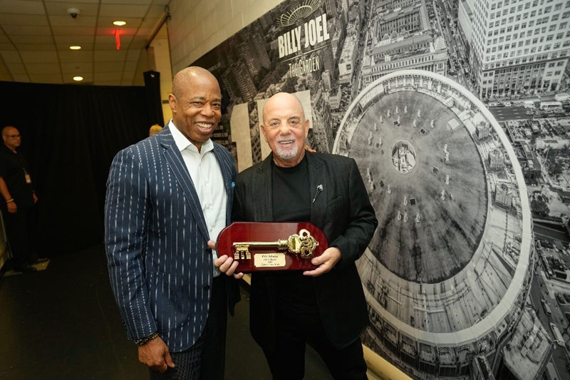 Billy Joel accepts the Key to the City of New York from Mayor Eric Adams.