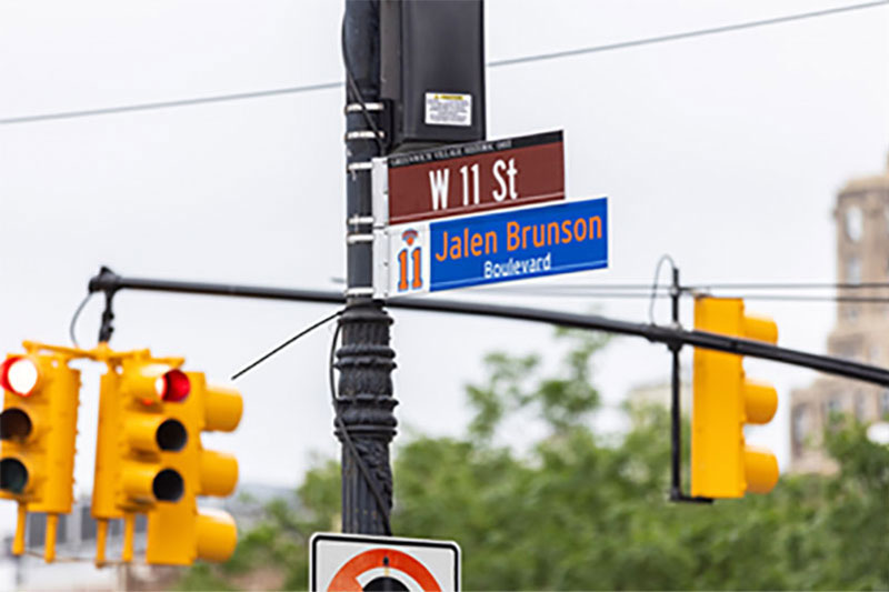 Jalen Brunson Boulevard street sign installed on W 11 Street signpost