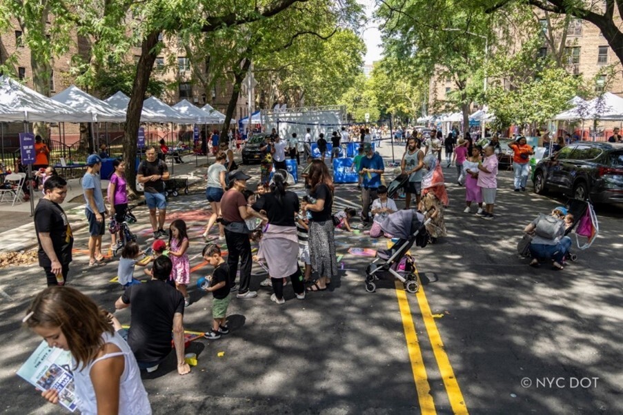 a group of people gather on the street