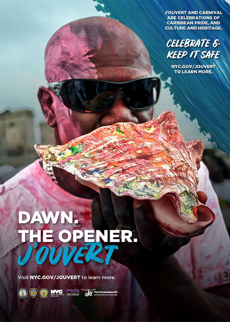 A man wearing sunglasses has part of his face and his clothing covered in pink dye. He’s holding a giant conch shell, also dyed in multi-colors, up to his mouth in preparation to blow through it and make a noise like a horn. The text asks participants to celebrate Caribbean pride, culture and heritage, and to keep J’Ouvert safe.