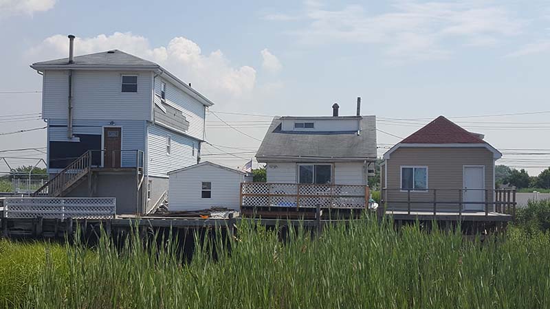 Three houses with porches