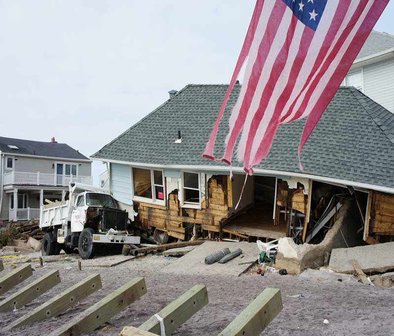 House destroyed by Hurricane Sandy with outer wall torn off