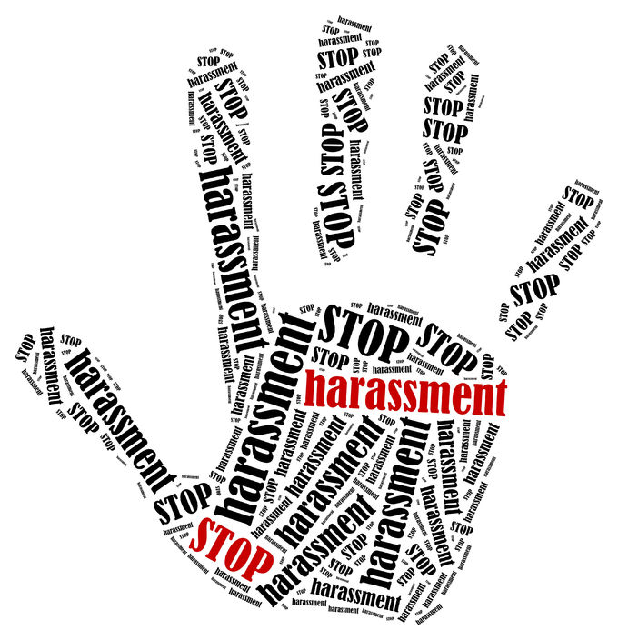 the words stop harassment in the shape of a open palm