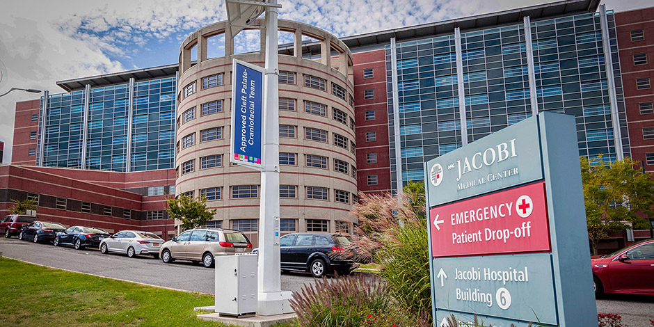 Jacobi medical center, a wide multi-story building made of brick, concrete, glass, and steel
