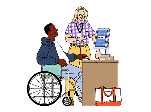 A middle-aged Black man in a wheelchair is sitting at a desktop computer while a young White female digital navigator helps him with a password.