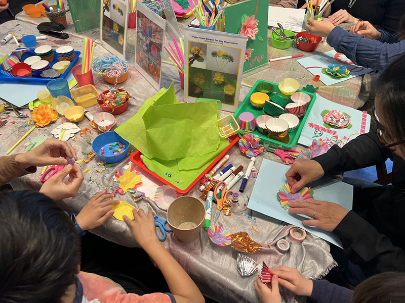 People working on arts and crafts on a table