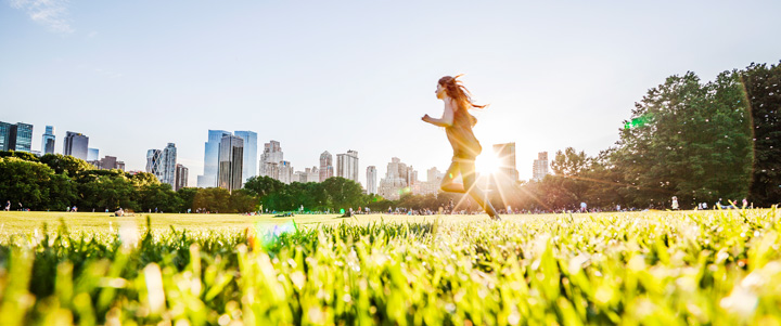 Jogger enjoying a sunny day in a New York City park