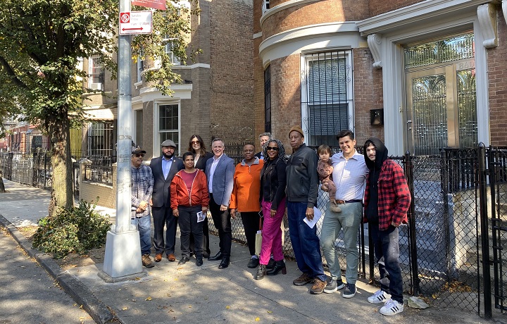 group of people standing in front a building