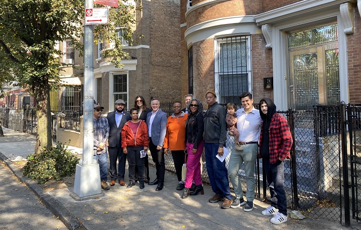 group of people standing in front of a building