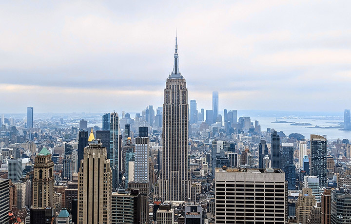 Aerial photo of Manhattan skyline with Empire State Building in the foreground
                                           
