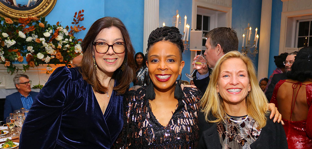 Three smiling people