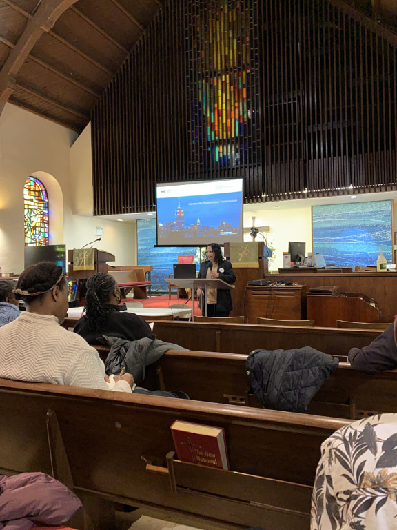 Woman speaking at podium in church building