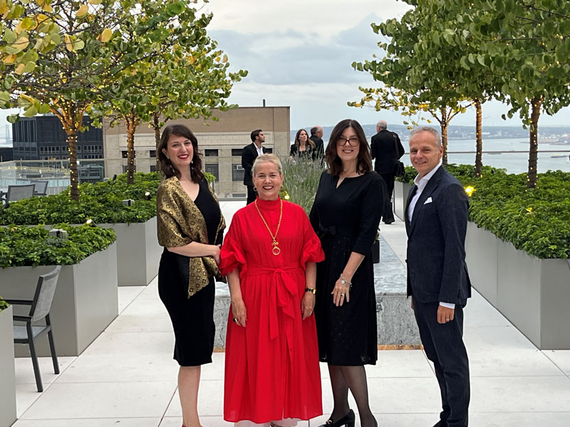 Association President Anna Kupik, Printemps America CEO Laura Lendrum, LPC Chair Sarah Carroll, Printemps Global CEO Jean-Marc Bellaiche psoing in a group photo in on a rooftop garden