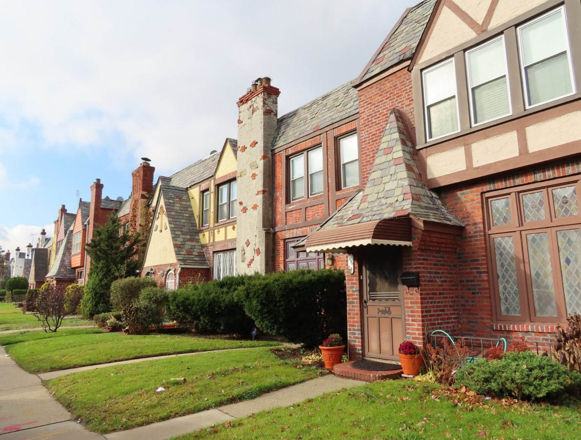 : Row of Tudor and Storybook-style design row houses in the Cambria Heights 227th Street Historic District