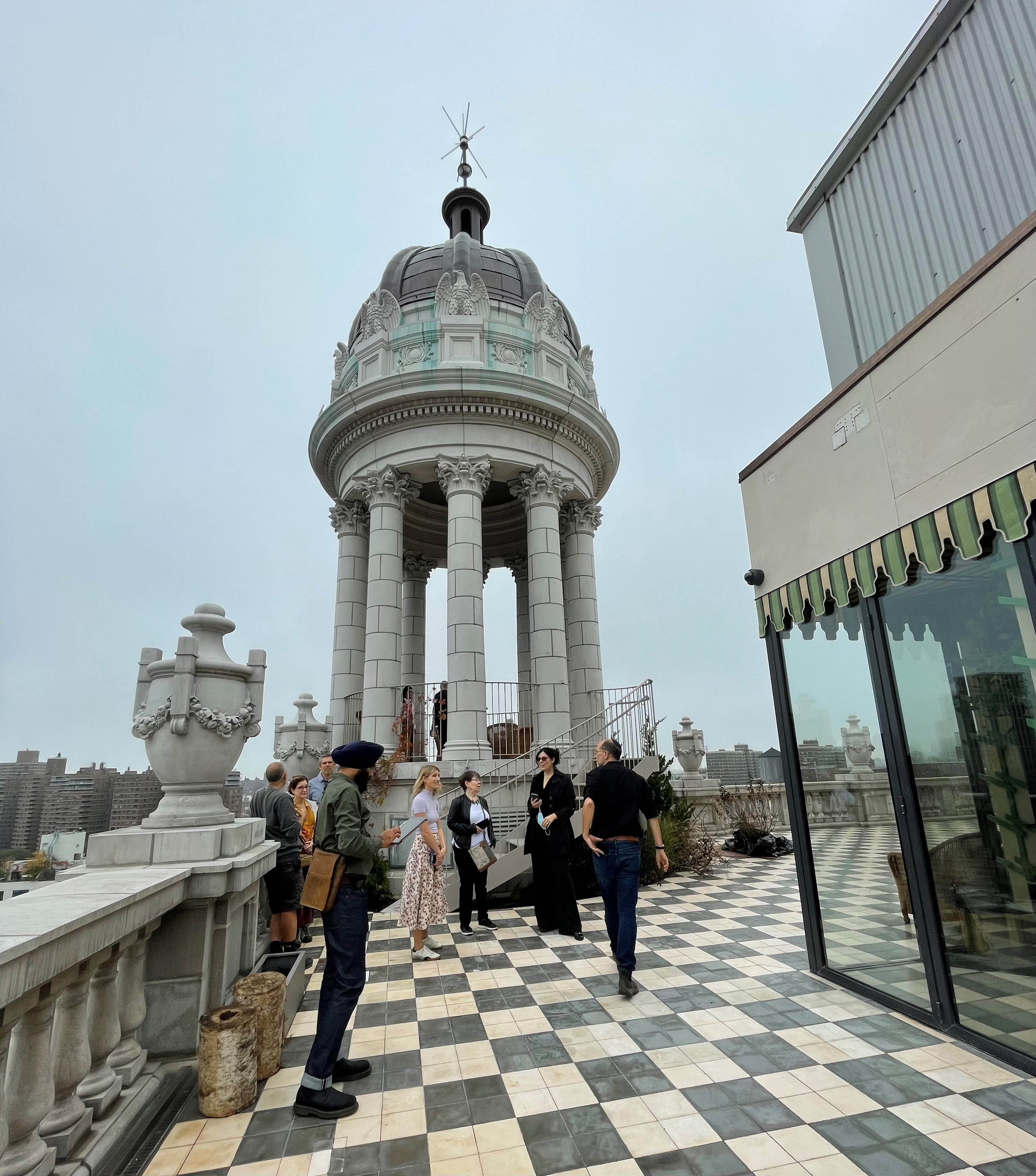 LPC Commissioners and staff tour the roof of the Jarmulowsky Bank Building to get an up-close look at the signature dome and other restored elements