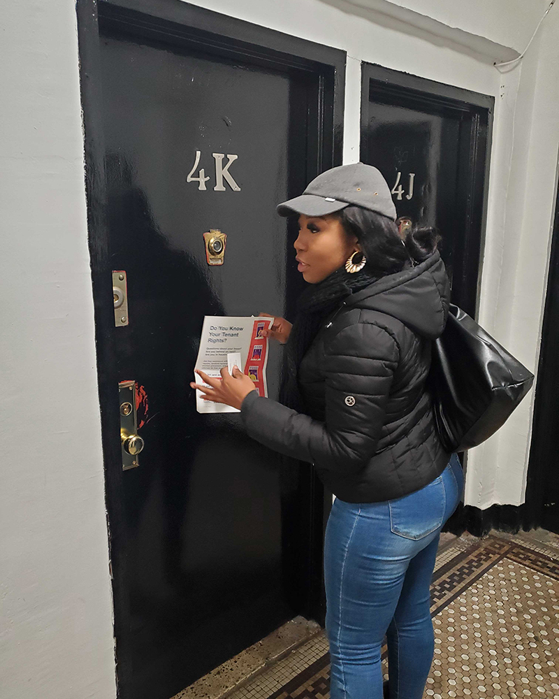A PEU Specialist knocks on a NYC apartment door, holding a flyer about tenant rights