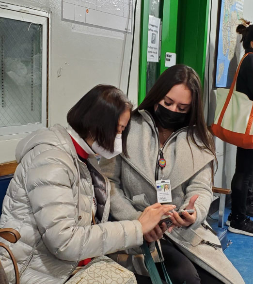 A P E U specialist is helping a woman to apply Emergency Rental Assistance Program 