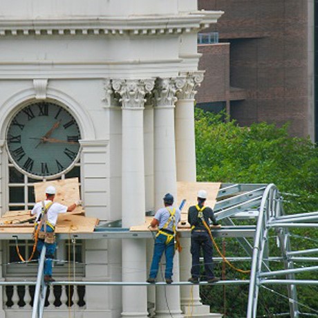 Men working around clock tower